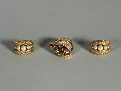 three gold tone rings with pearls and leaves on them