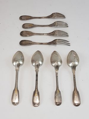 six silver spoons and six forks are lined up on a white surface