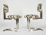 a pair of chairs with black and white designs on them