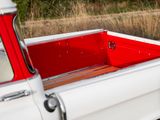 a red and white truck with a red bed in the back