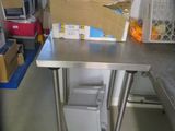 a metal table with a box on top of it