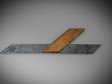 a wooden ruler that is laying on the ground