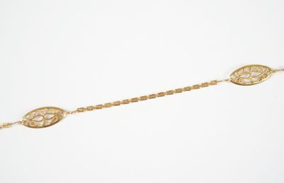 an image of a gold bracelet on a white background