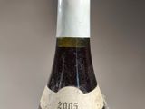 a bottle of wine that is sitting on a table