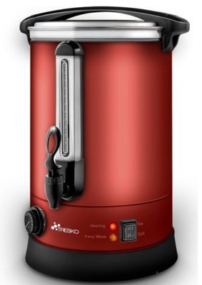 the red electric kettle is sitting on a white surface