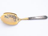 a spoon with a spoon handle on it on a white surface