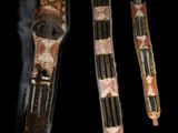 three pieces of wood with different patterns on them on a black background