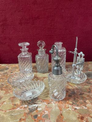 a lot of glass items on a table with a red background