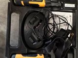a black and yellow case with two different items in it