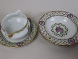pair of porcelain bowls and saucers with floral designs