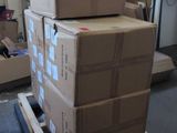 boxes stacked on top of each other on a pallet in a warehouse