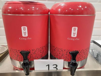 two red containers that are sitting on a counter