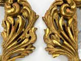 pair of antique gold leaf mirrors on a white surface