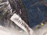 a plastic bag that has some sort of clothing on it