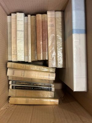 a box full of books that are sitting on the floor