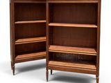 pair of mid - century walnut bookcases with open shelves