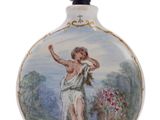a small bottle with a painting of a woman on it