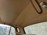 a view of the inside of a car from the driver ' s seat