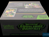 a box of pokemon trading cards on a black background