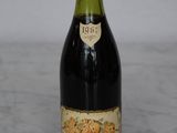 a bottle of wine that is sitting on a table
