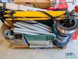 a box full of different types of tools on the floor