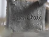 a close up of a metal object with writing on it