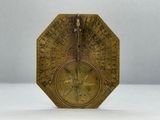 an old brass clock with roman numerals and roman numerals on it