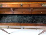 a wooden desk with a marble top and two drawers