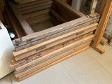 several pieces of wood are stacked on top of each other in a room
