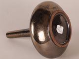 a metal knob with a hole in the middle of it