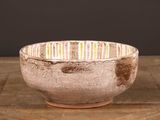 a bowl that is sitting on a wooden table