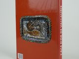 a red book with a picture of a boat on it