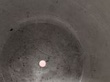 a close up of a toilet bowl with a toilet paper roll in it