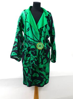 green and black robe on a mannequin stand with a white background