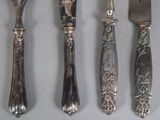 five different types of silverware on a table