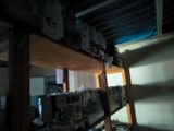 a shelf with a bunch of appliances on it