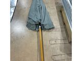 a picture of an umbrella laying on the floor in a warehouse