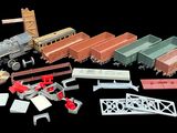 many different types of toy trains on a black background