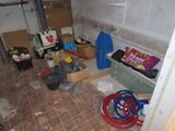 an image of a room that has a lot of stuff on the floor