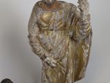 a statue of a man and a woman standing next to each other