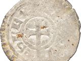 Gros plan sur une pièce de monnaie portant une croix