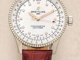 a close up of a watch on a white surface