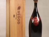 a bottle of wine sitting next to a wooden box