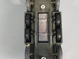 a toy army vehicle that is sitting on a table