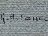 a close up of a piece of wood with writing on it