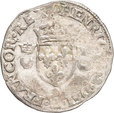 a close up of a coin with a crown on it