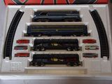 a box with a train set in it on a table