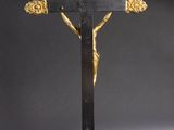 a black and gold crucif with a cross on it