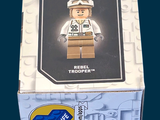 a box with a lego figure in it on a blue background