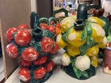 many vases that are sitting on a shelf